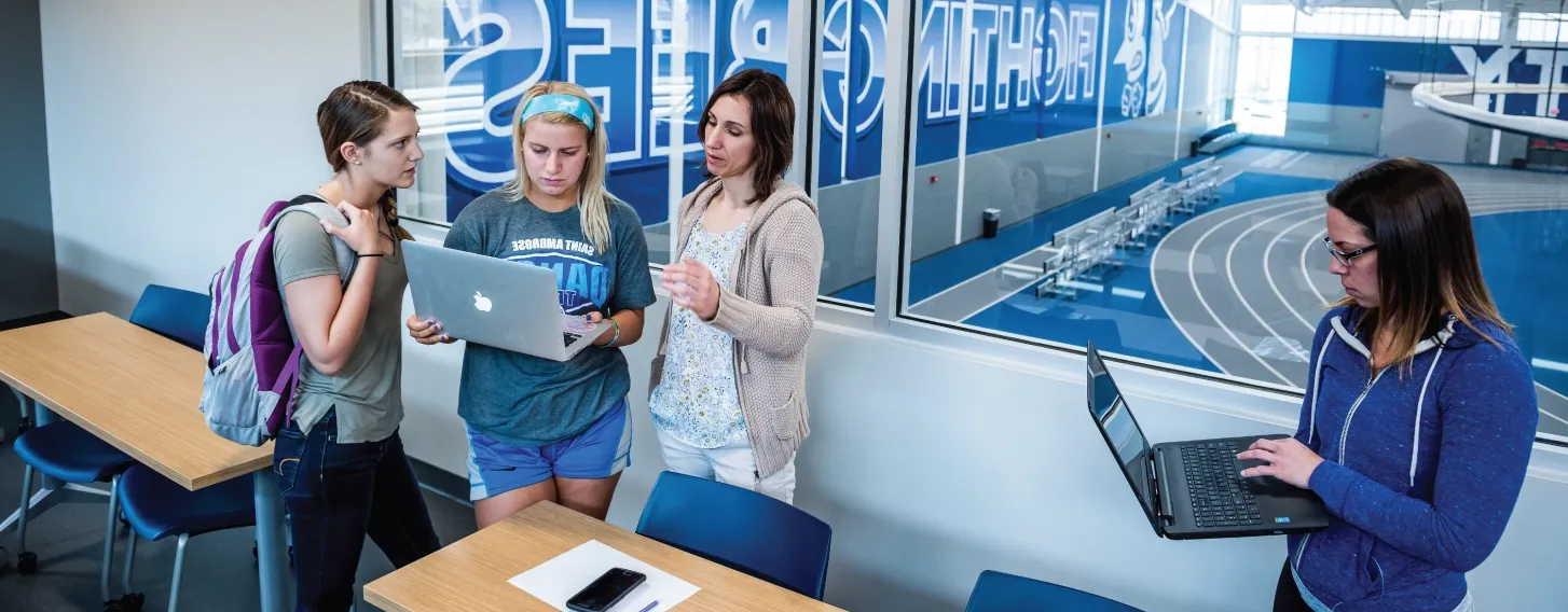 Sport management students in classroom overlooking athletic facilities.